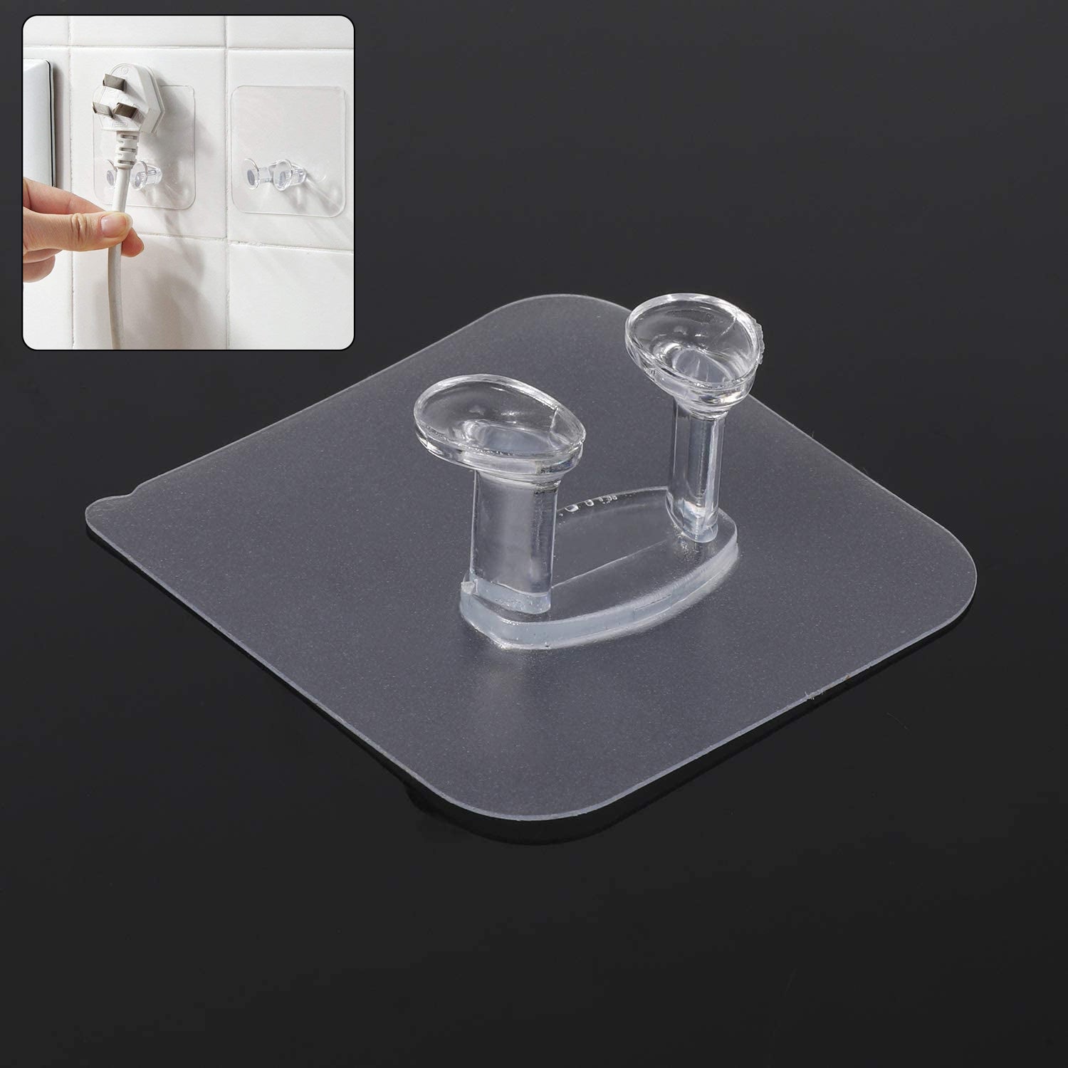 Transparent self-adhesive wall hook mounted on a clean, smooth wall.
