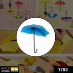 Set of three multi-coloured umbrella key holders arranged decoratively.