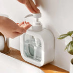 Comparison shot of the clear soap dispenser next to another bathroom accessory.