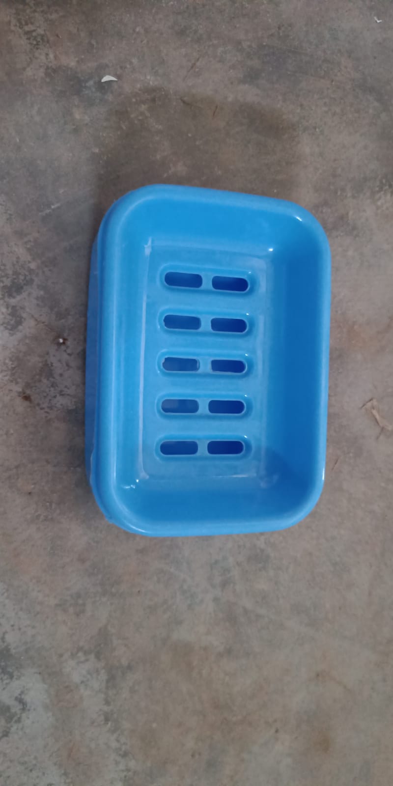 Close-up of the covered soap holder, emphasizing its smooth finish.