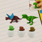 A set of five colorful dinosaur puzzle erasers and egg shapes.