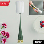 Multifunctional silicone bottle cleaning brush effectively cleaning a tall glass bottle.