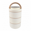 A three-layer Ganesh stainless steel lunch box, shown from the front with its secure lid.