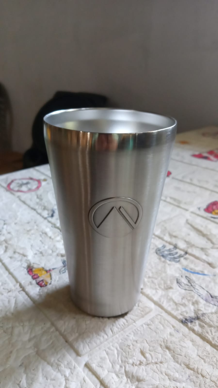 Versatile travel mug displayed in a dynamic outdoor setting, ready for adventure.