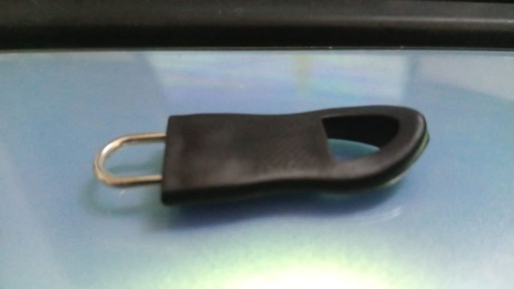 Detailed view of the strong metal component of the Zipper Pull Tab, highlighting its quality.