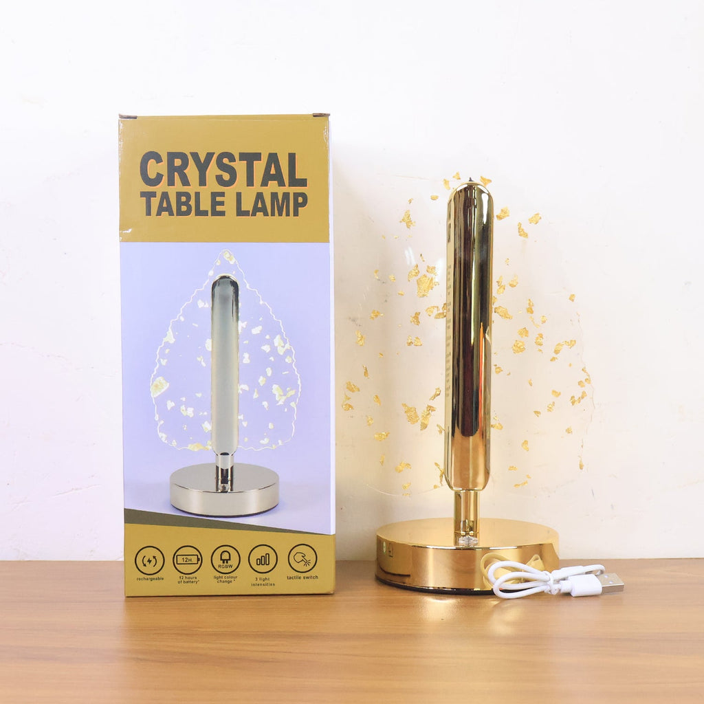 Lifestyle photo of golden crystal leaf LED desk lamp during evening lighting