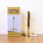 Lifestyle photo of golden crystal leaf LED desk lamp during evening lighting