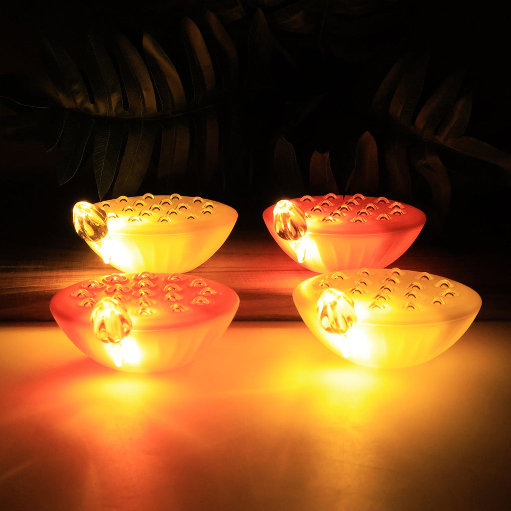 Battery-operated lotus LED lamps emitting warm glowing light for festive ambiance