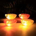 Battery-operated lotus LED lamps emitting warm glowing light for festive ambiance
