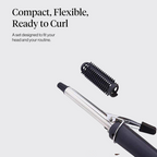 Hair curling iron resting on its safety stand on a surface.