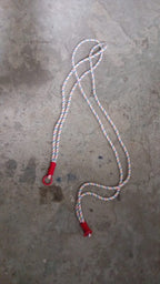 Lifestyle image showing a smartphone easily accessible via its phone lanyard from a bag.