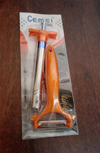 Packaging for the CookAura Gas Lighter Peeler Combo set.