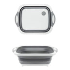 Compact foldable chopping board with dish rack and washing bowl features.