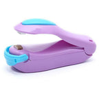 Side view of the compact mini heat sealer, emphasizing its ergonomic shape.