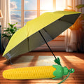 Compact vegetable shaped folding umbrella in its protective plastic case.