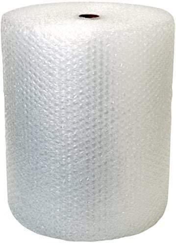 White bubble wrap roll being used to secure a box, demonstrating effective shipping packaging material.