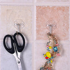 The full 100-pack of multipurpose stainless steel adhesive wall hooks, ready for use.