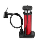 Sleek portable foot pump displayed on a wooden surface, ready for use.