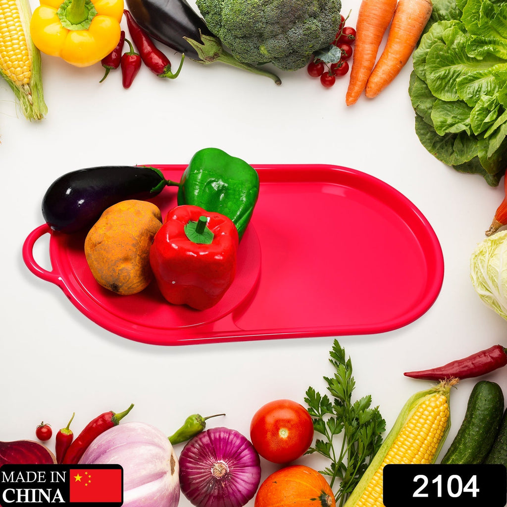 Ergonomic plastic cutting board with a sliding collection tray.