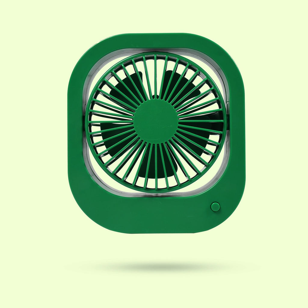 Rechargeable travel fan standing on a surface, highlighting its compact design.