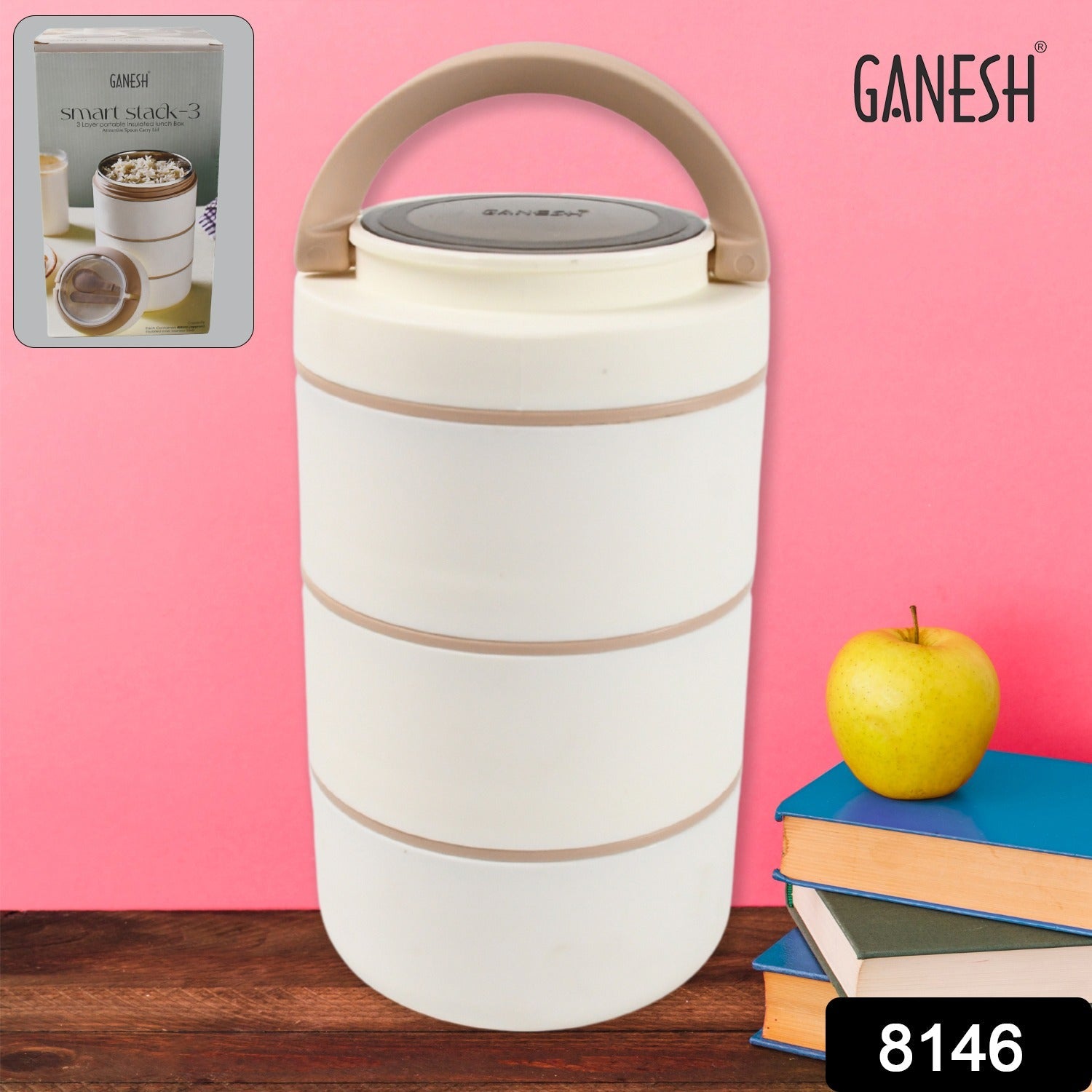The Ganesh Smart Stack stainless steel lunch box displayed with an apple and a fork, suggesting a healthy meal.