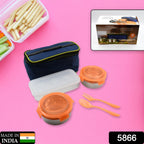 An open stainless steel lunch box revealing its three spacious compartments.
