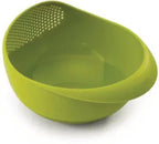 Ergonomic plastic rice strainer with handles, suitable for kitchen tasks.