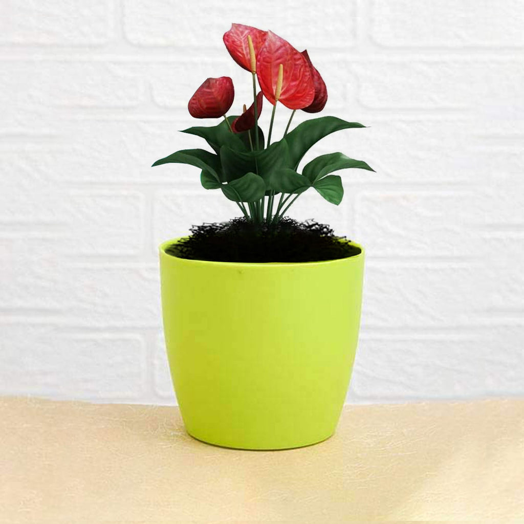 Durable plastic flower pot with a round shape, ideal for indoor and outdoor plants.
