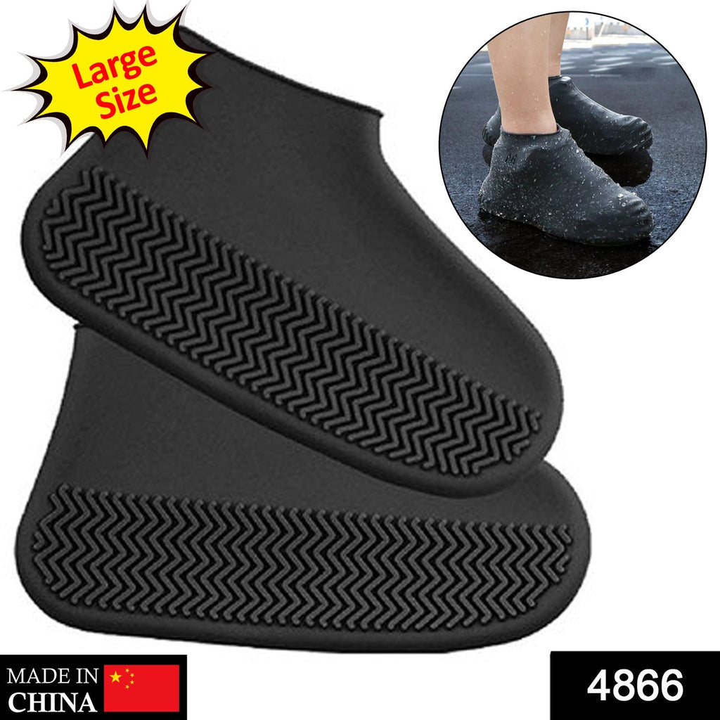 Pair of foldable waterproof silicone shoe covers in packaging.