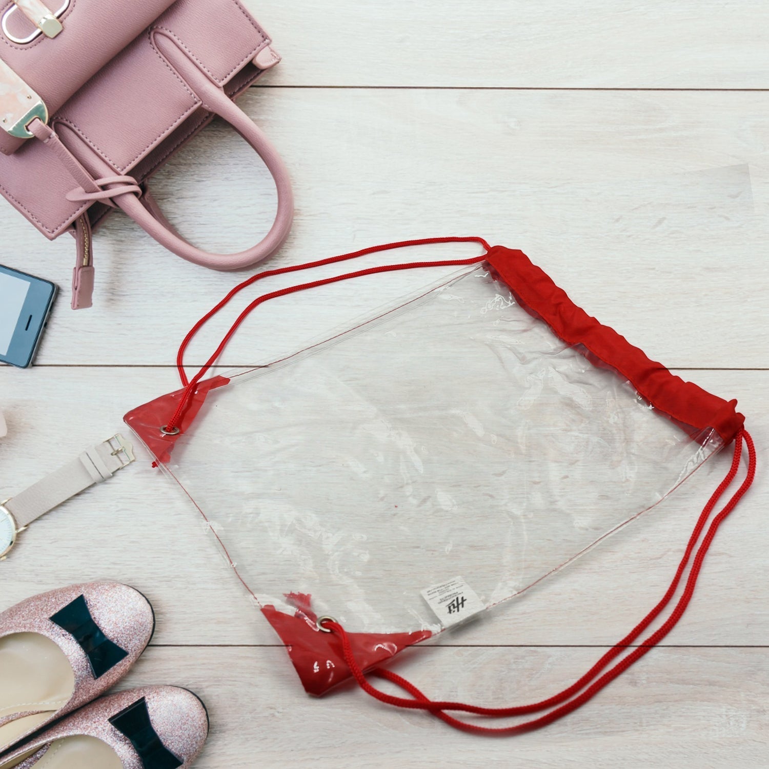 Clear waterproof stadium bag for carrying essentials to events and the gym.