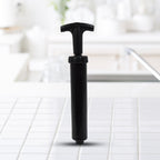 Handheld air pump with flexible hose for easy inflation.