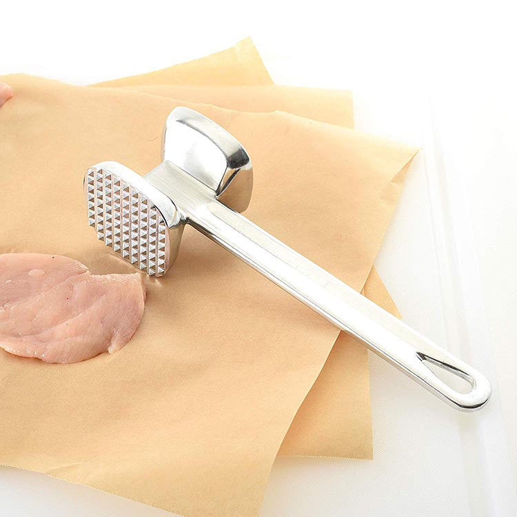 Meat tenderizer hammer with a flat side for pounding and shaping.