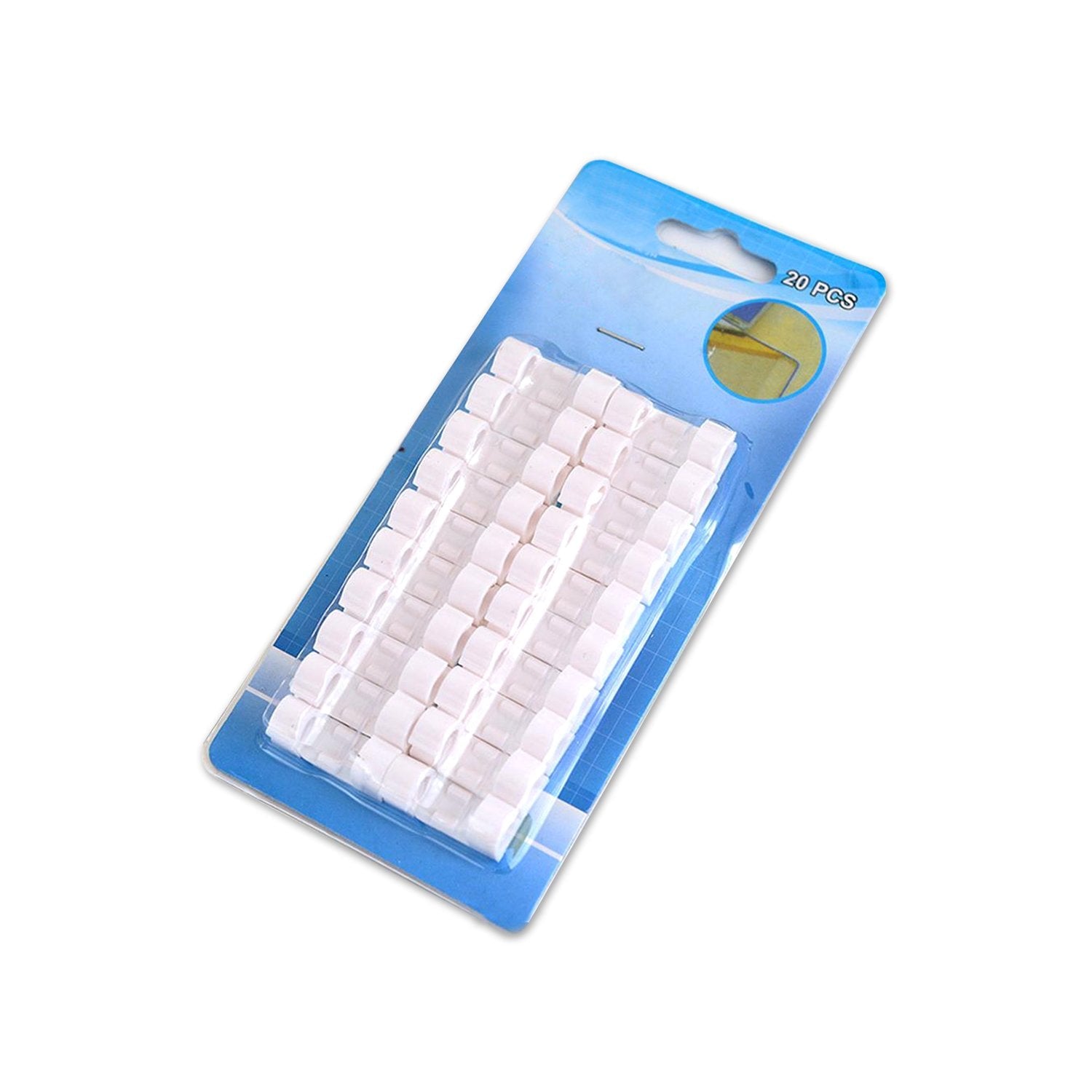 Round sticky cable clips mounted on a desk surface, keeping charging cables accessible.
