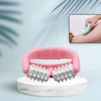 Hand holding the compact cellulite roller, ready for use.