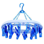 Side view of the space-saving round plastic cloth drying hanger with 18 clips.