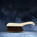 Multipurpose cleaning brush for clothes, sofas, and desks, offering gentle dust removal.