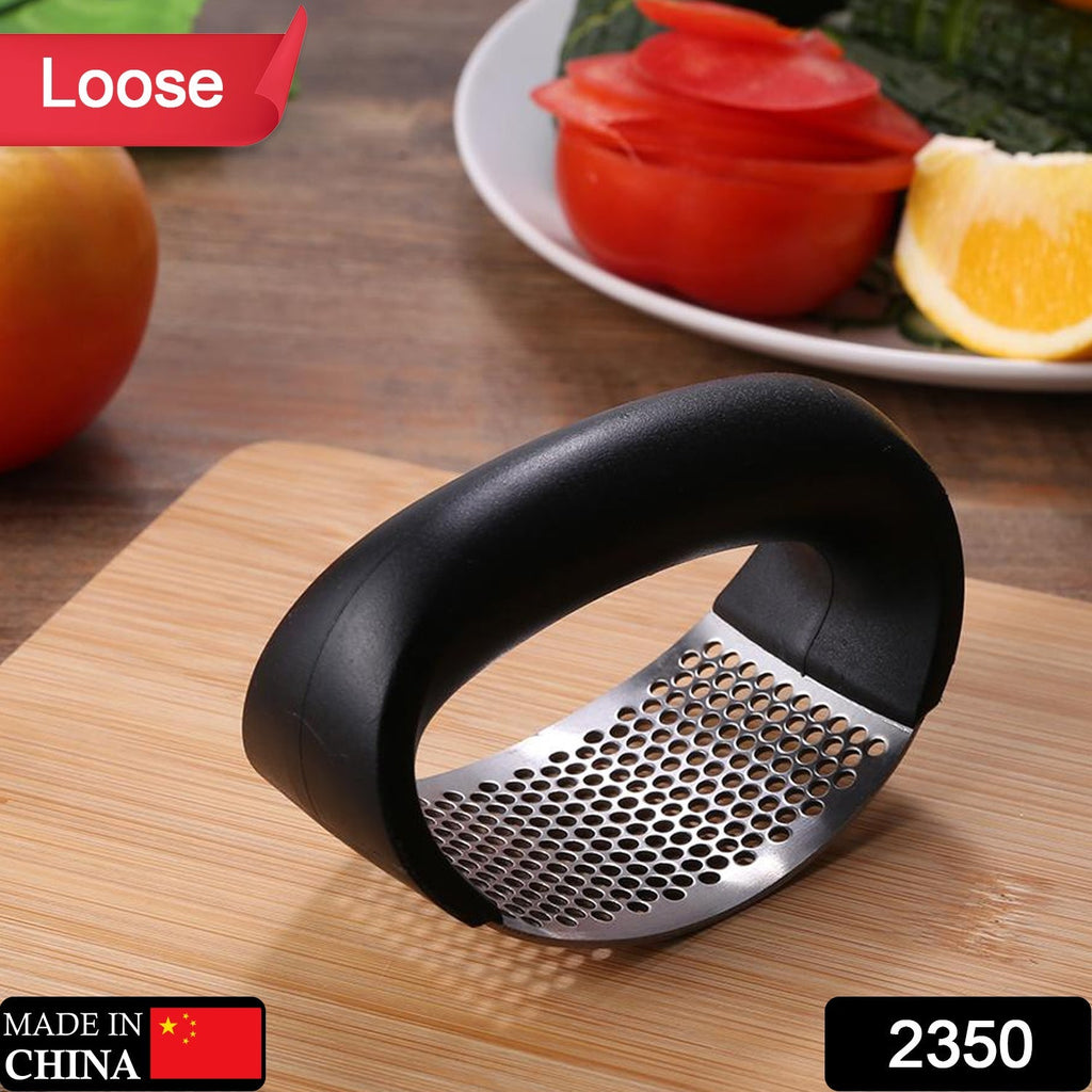 Close-up of the durable stainless steel garlic press, highlighting its sturdy design.