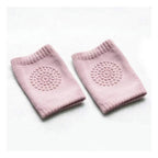 Pair of soft crawling knee pads in grey, designed for toddler comfort and safety.