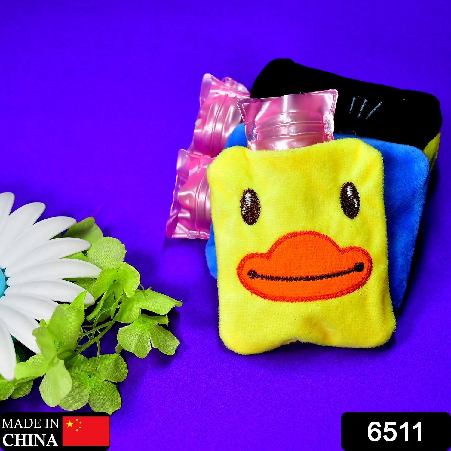 Front view of a cute yellow duck hot water bottle.