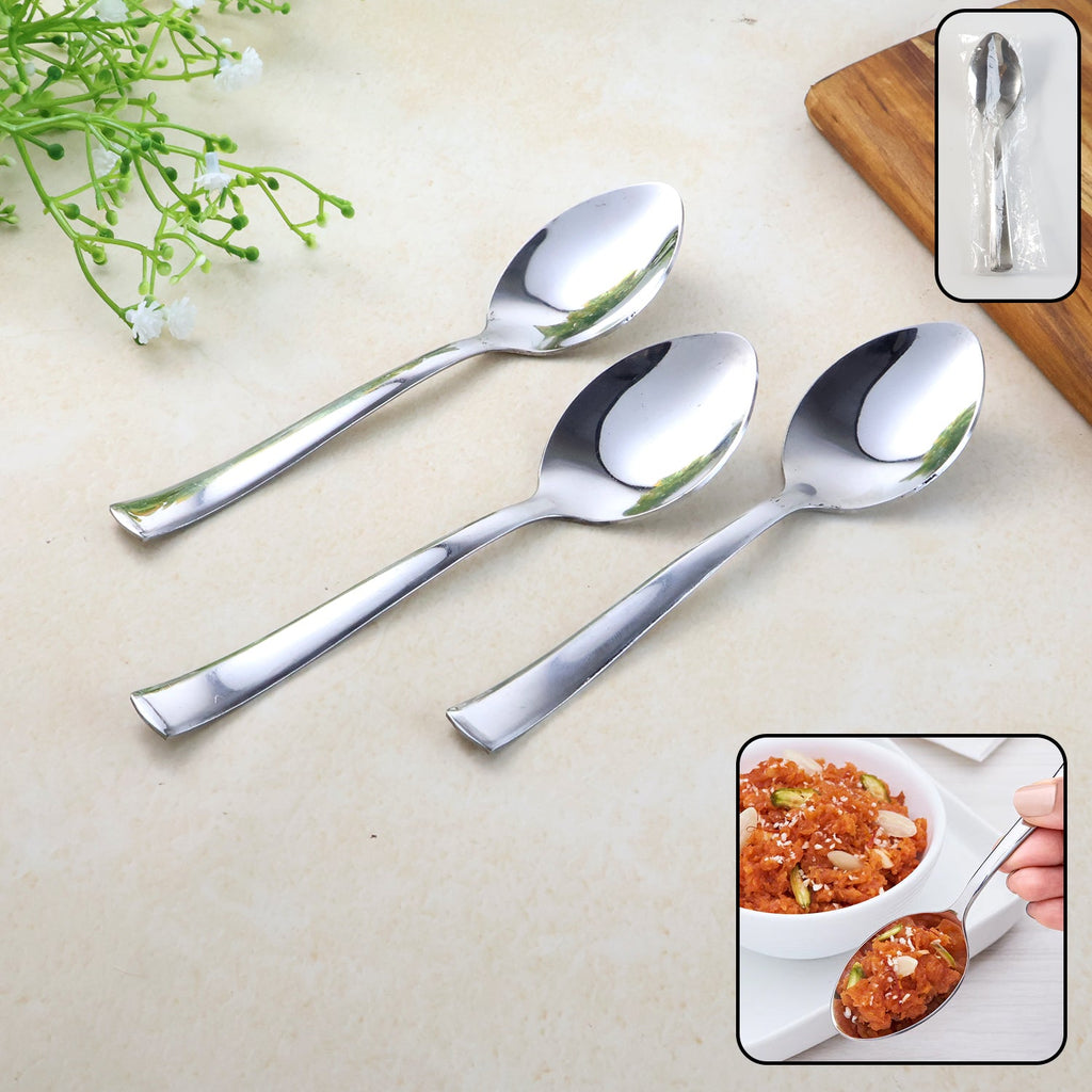 Set of three stainless steel everyday dining spoons on white background