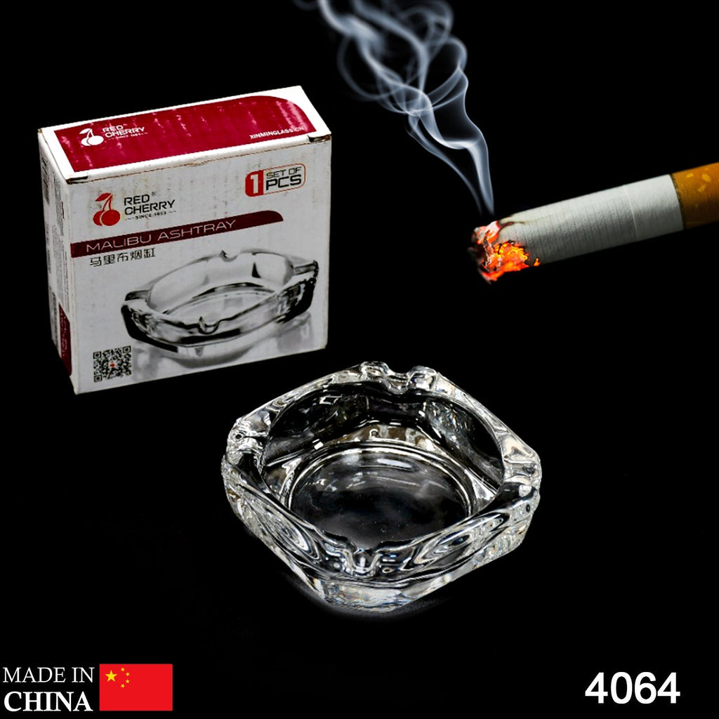 Round crystal glass ashtray, showcasing its clear finish in an office setting.