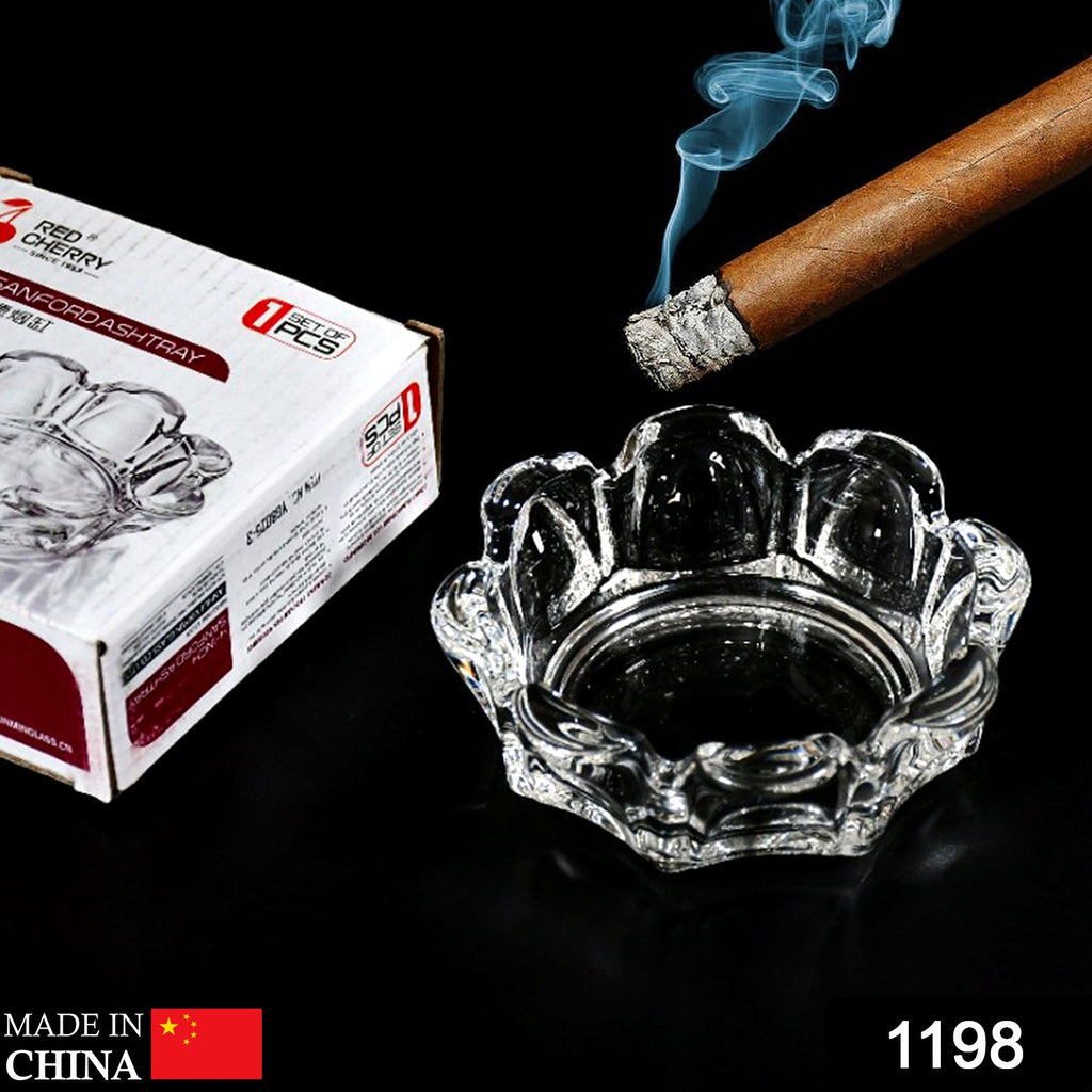 Elegant round glass ashtray with four cigarette slots for home or office use.