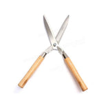 Indo Glow Hedge Shears resting on green foliage, ready for efficient garden maintenance.