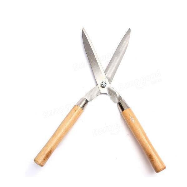 Indo Glow Hedge Shears resting on green foliage, ready for efficient garden maintenance.