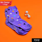 Close-up of a model wearing vibrant patterned ankle socks with casual shoes.