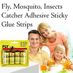 Fly catcher sticky strip hanging outdoors, trapping insects.