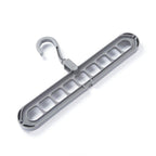 Several shirts and trousers neatly hung on the innovative 9-hole space saving hanger.