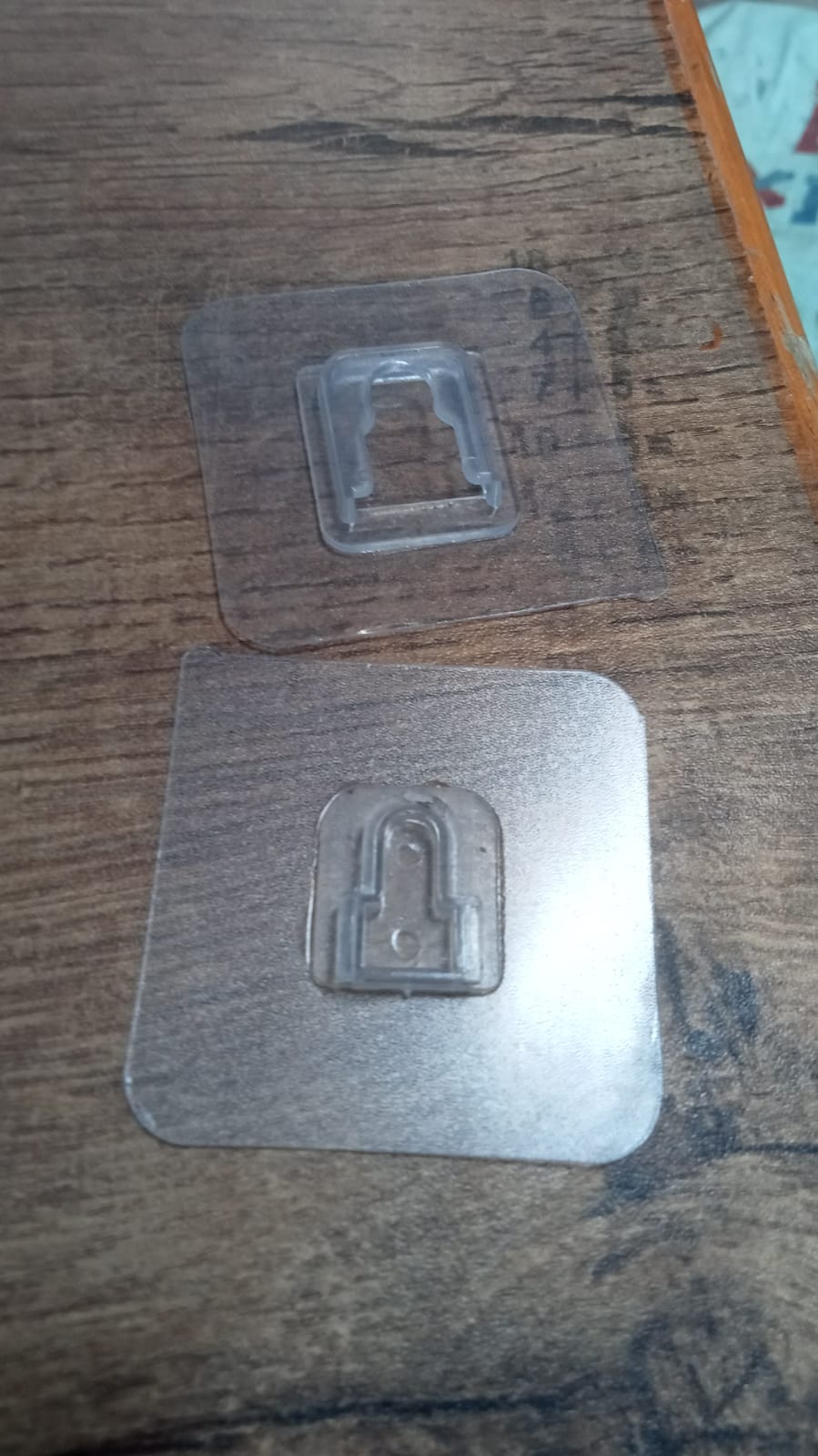Lifestyle image of GlimmerHome heavy-duty adhesive hooks used for various home organization needs.