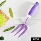 Sturdy metal cultivator from the garden tool kit for aerating soil.