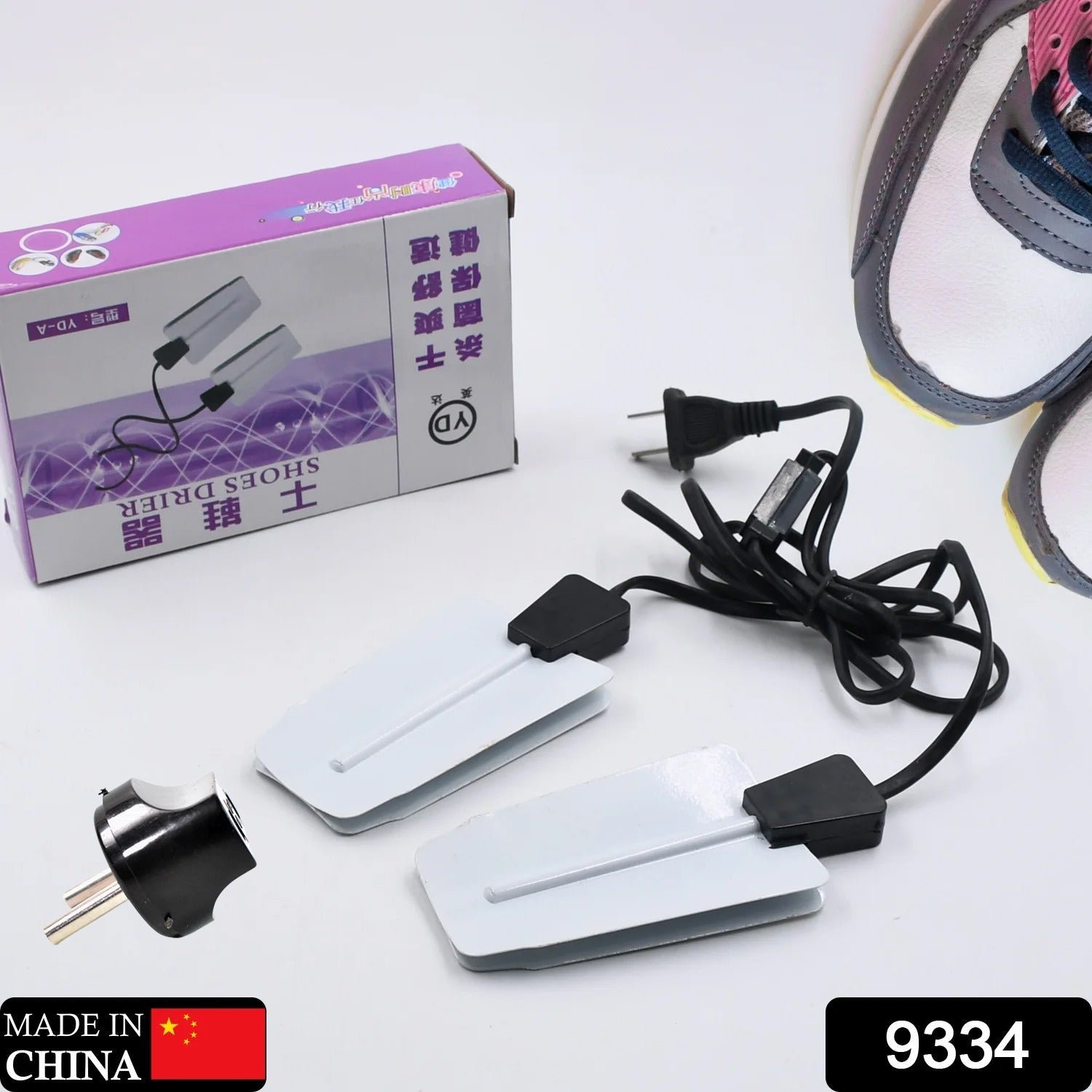 Electric portable shoe dryer 220V shown from an angle, compact and USB powered.